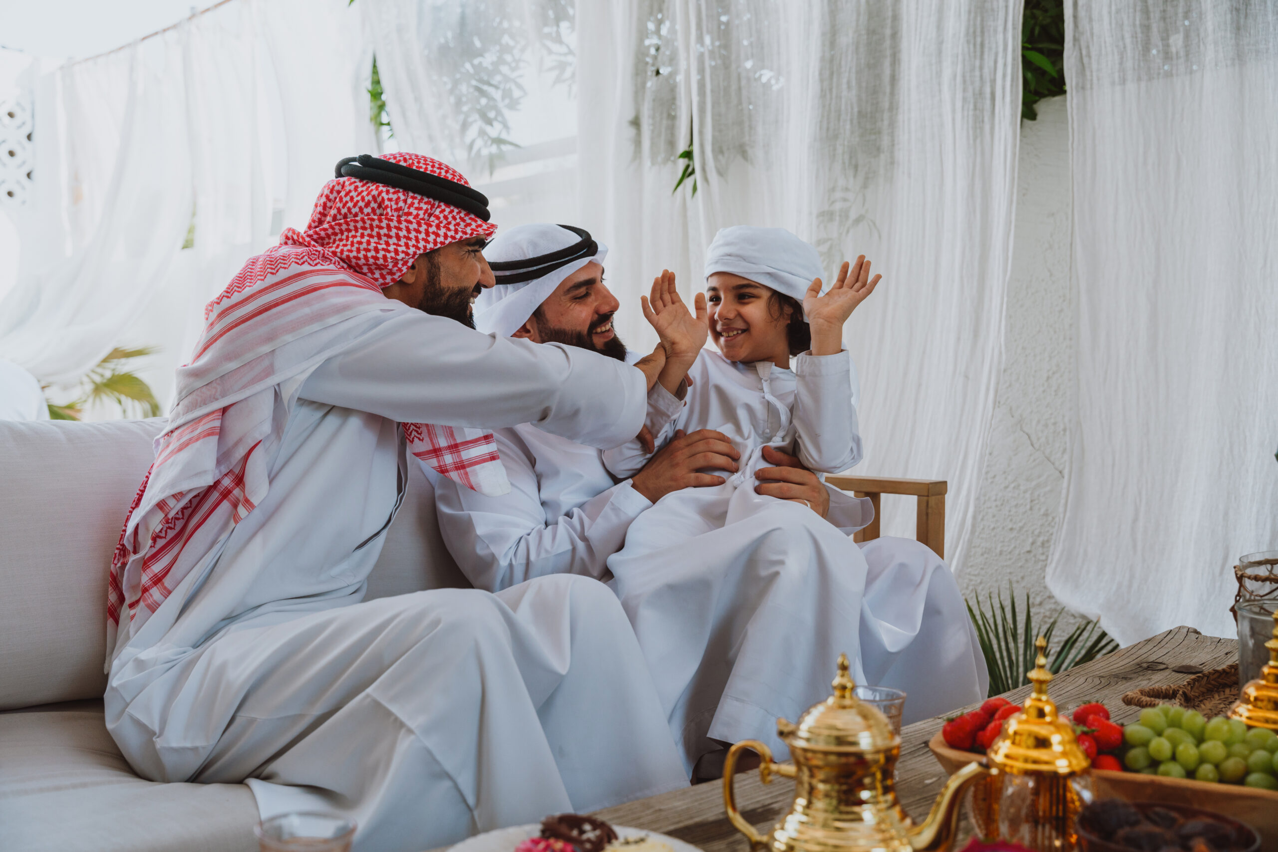 Arab family bonding, father and son relaxing